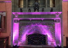 purple uplighters on fireplace at bucks hall